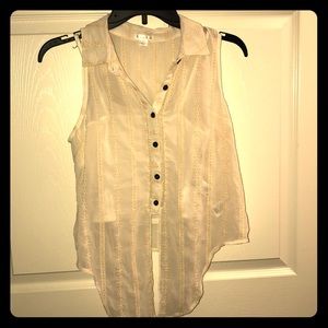 Cream colored, sleeveless shirt